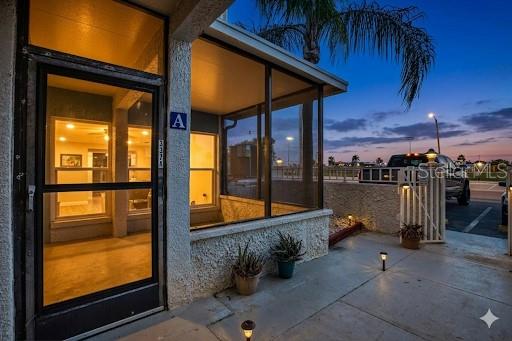 337 Rex Place, Unit A Madeira Beach, FL 33708 - Photo 5 of 48 a view of a patio with a table and chairs