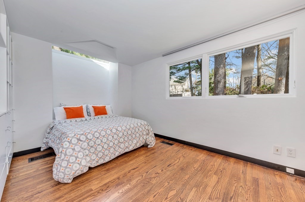 2 Field Road Lexington, MA 02421 - Photo 15 of 32 a bedroom with a bed and wooden floor