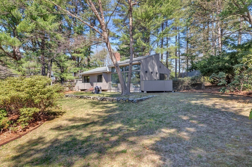 2 Field Road Lexington, MA 02421 - Photo 24 of 32 a front view of a house with garden
