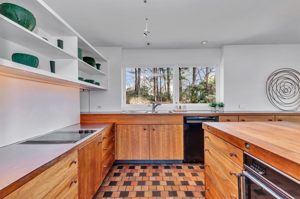 2 Field Road Lexington, MA 02421 - Photo 9 of 32 a kitchen with stainless steel appliances granite countertop a sink and cabinets