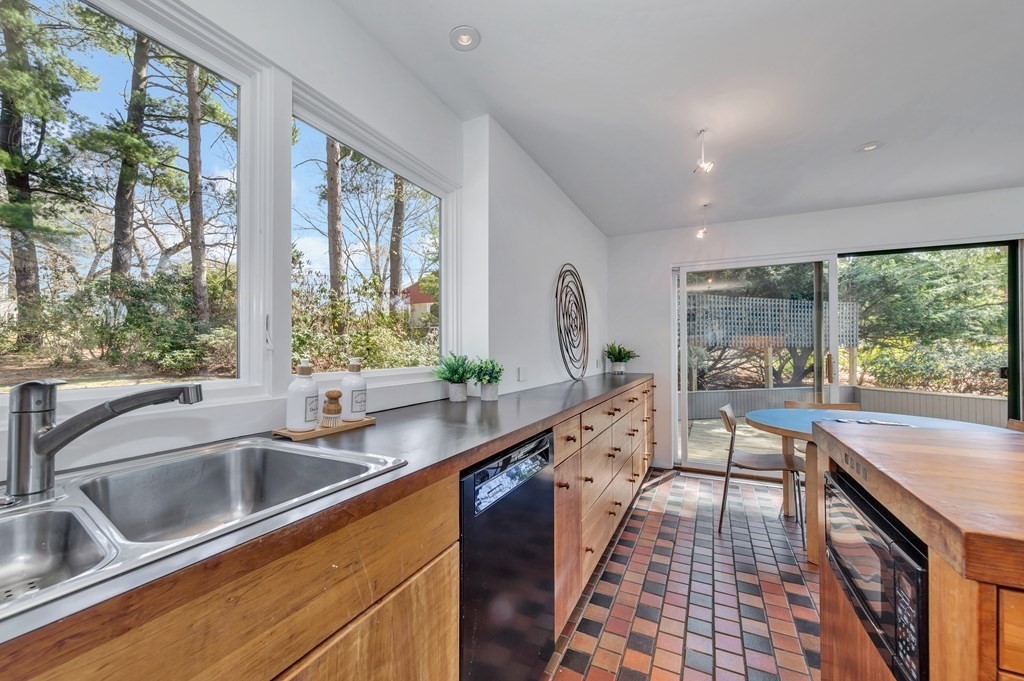 2 Field Road Lexington, MA 02421 - Photo 10 of 32 a kitchen with sink a large window and a counter top space