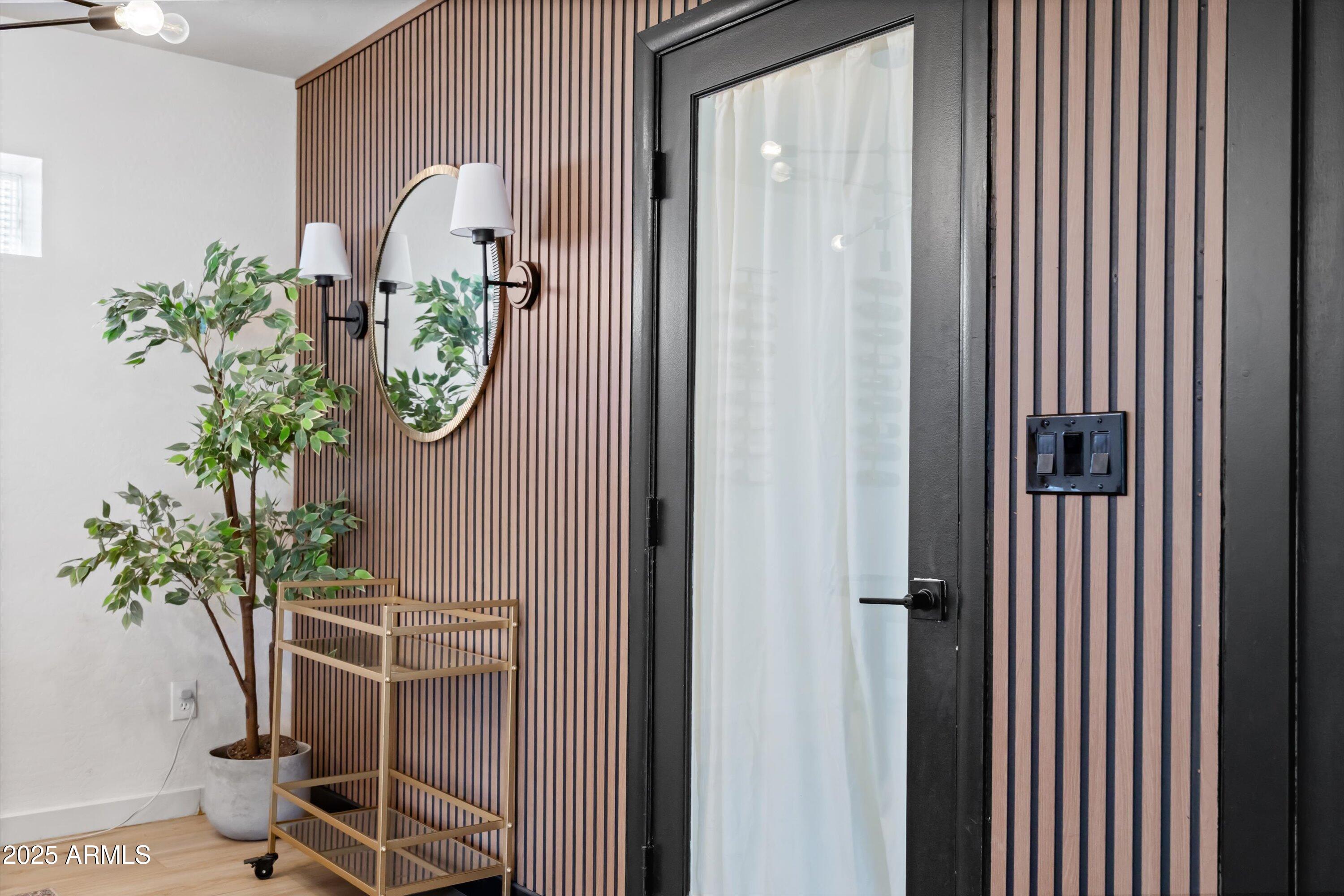 2201 East Weldon Avenue Phoenix, AZ 85016 - Photo 17 of 41 a vase with flowers sitting on a table in front of a door