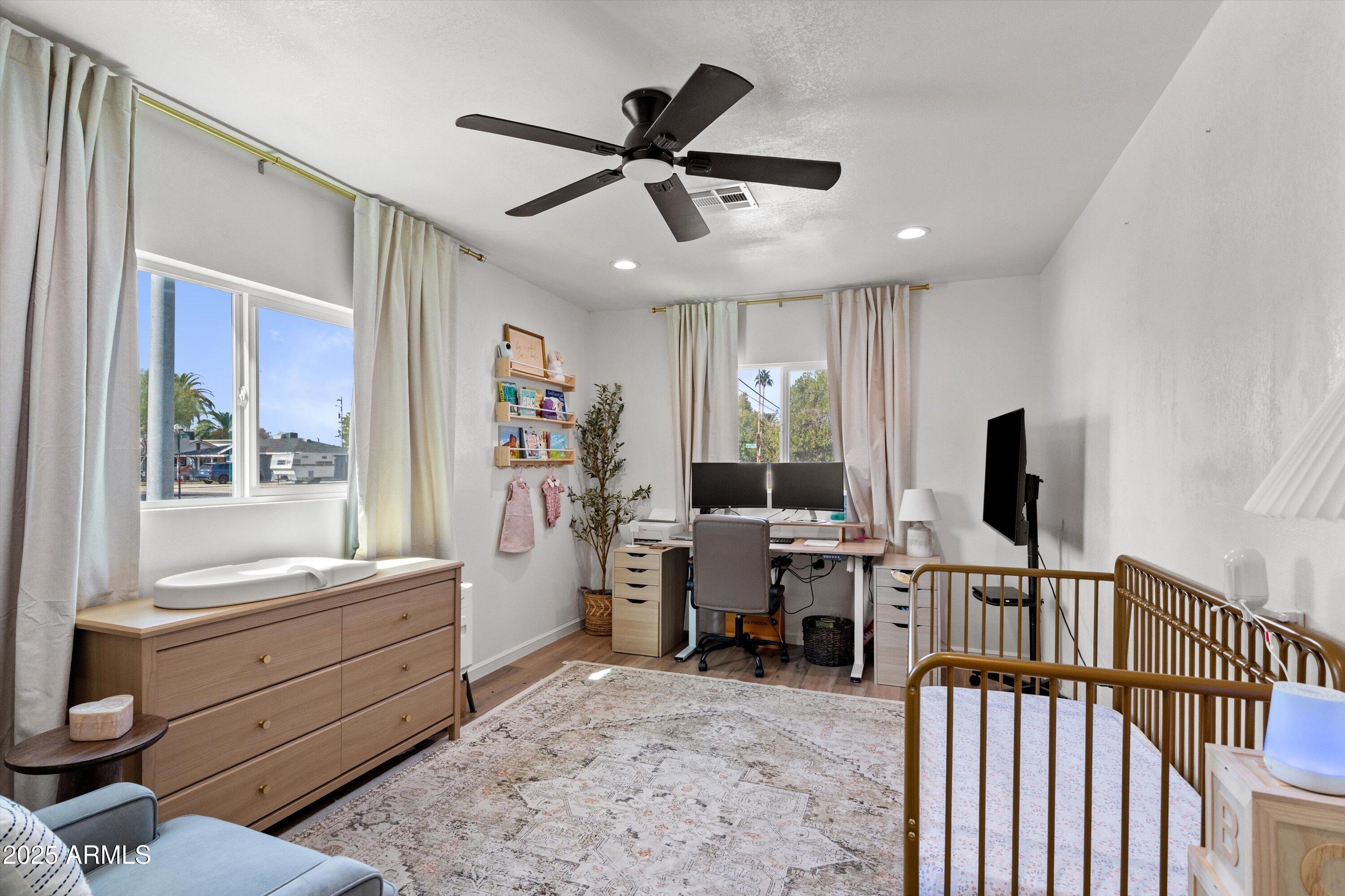2201 East Weldon Avenue Phoenix, AZ 85016 - Photo 18 of 41 a living room with furniture and flat screen tv
