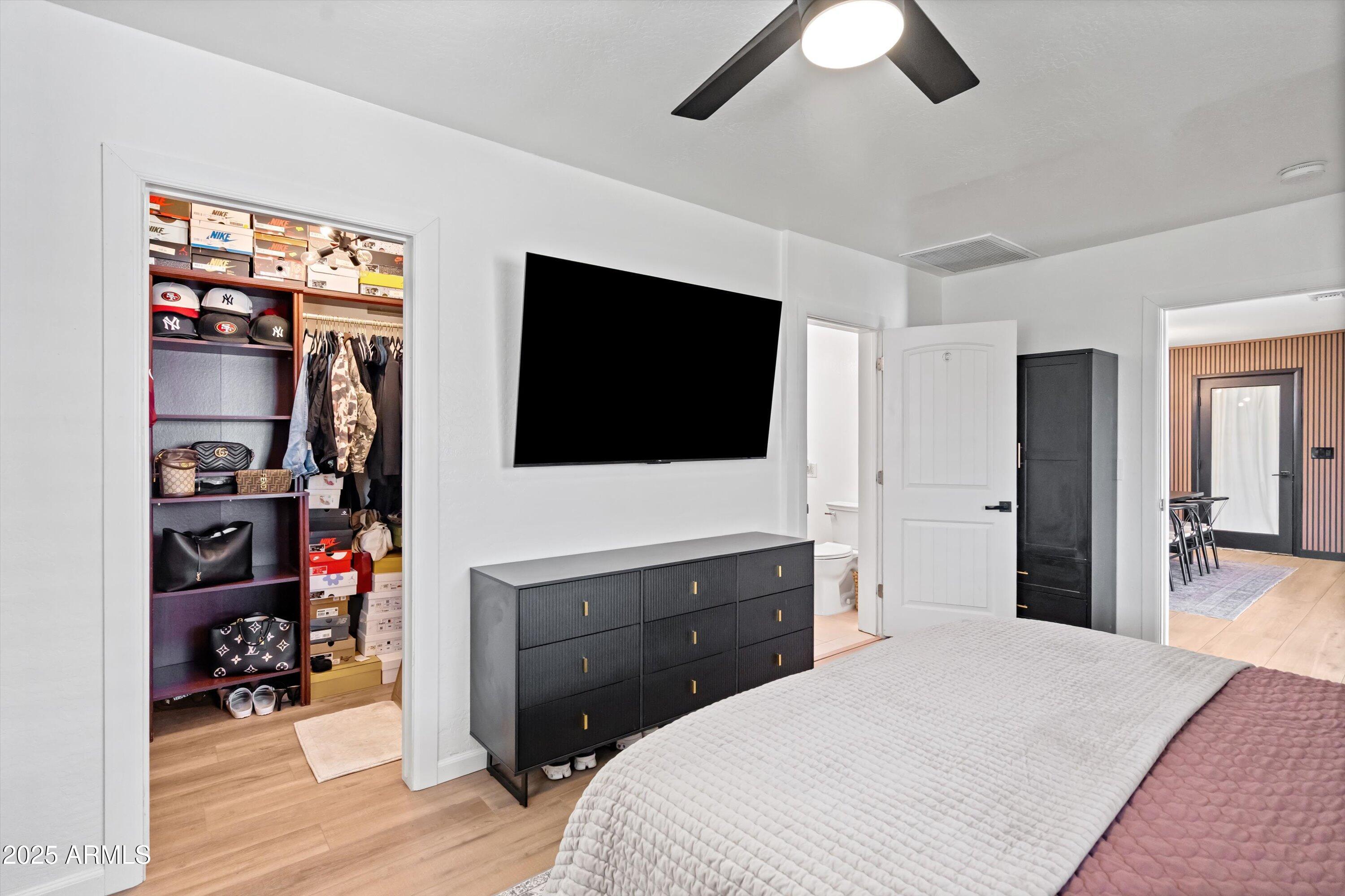 2201 East Weldon Avenue Phoenix, AZ 85016 - Photo 23 of 41 a bedroom with a bed and a flat screen tv