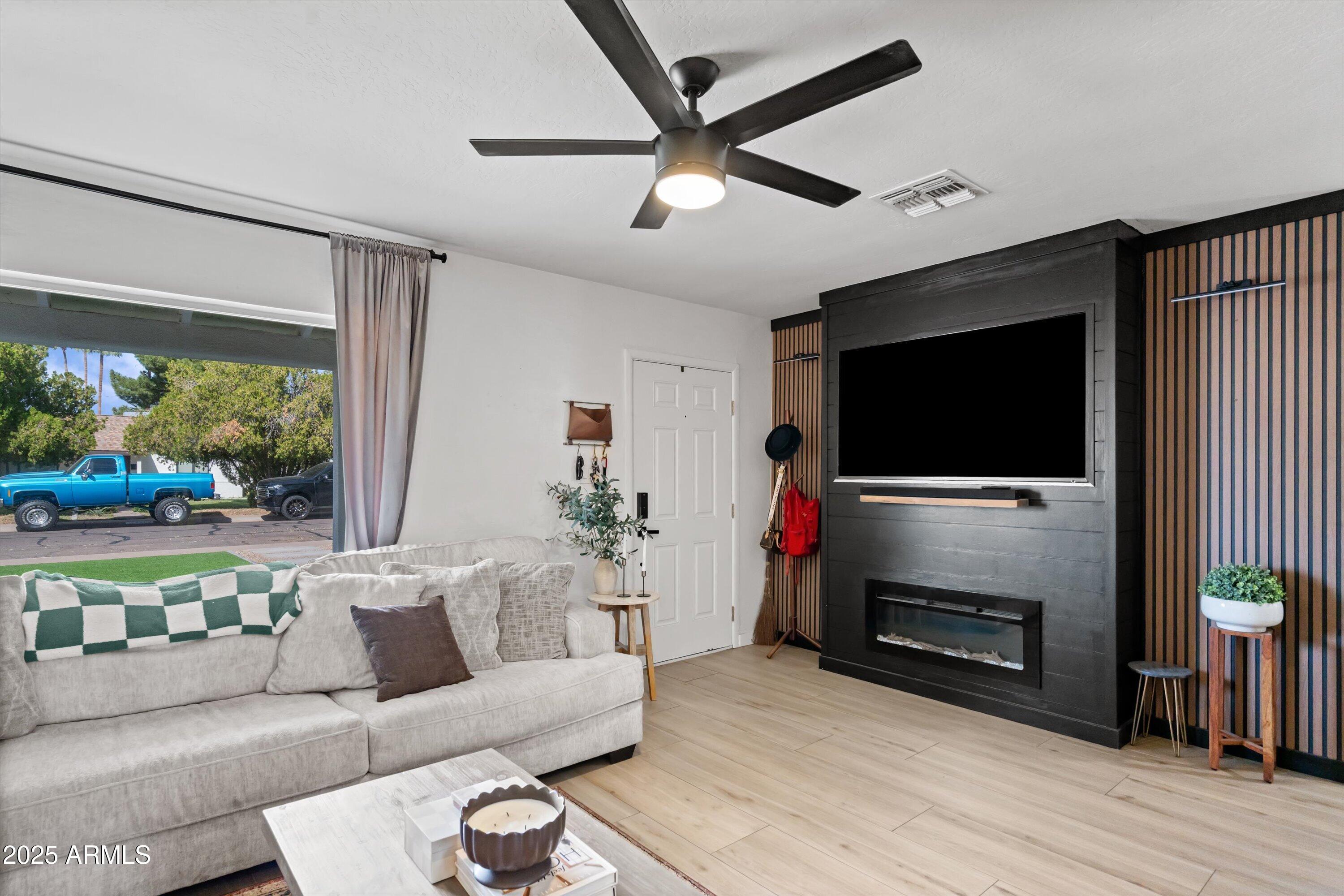 2201 East Weldon Avenue Phoenix, AZ 85016 - Photo 6 of 41 a living room with furniture and a flat screen tv
