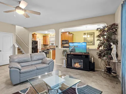 a bedroom with furniture and a large window