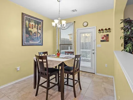 a kitchen with stainless steel appliances kitchen island granite countertop a sink and cabinets