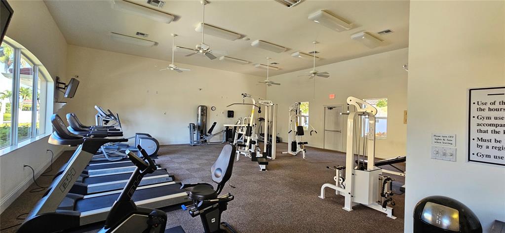 1502 Southwest 50th Street, Unit 104 Cape Coral, FL 33914 - Photo 17 of 18 a view of a room with gym equipment