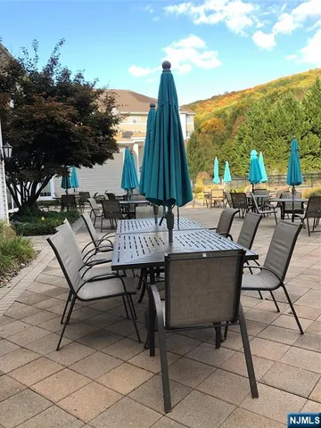 a view of chairs and table in patio