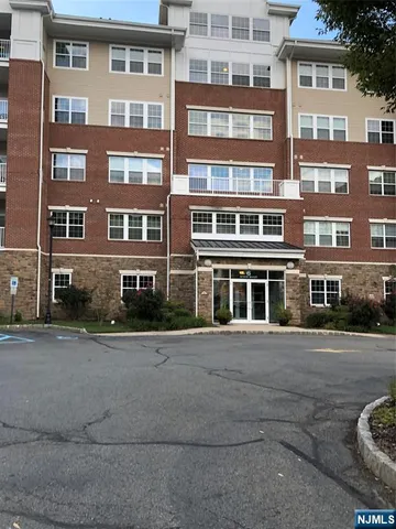 a front view of a building with lot of windows