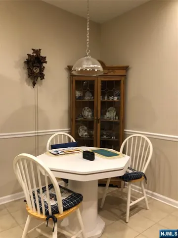 a view of a dining room with furniture and window