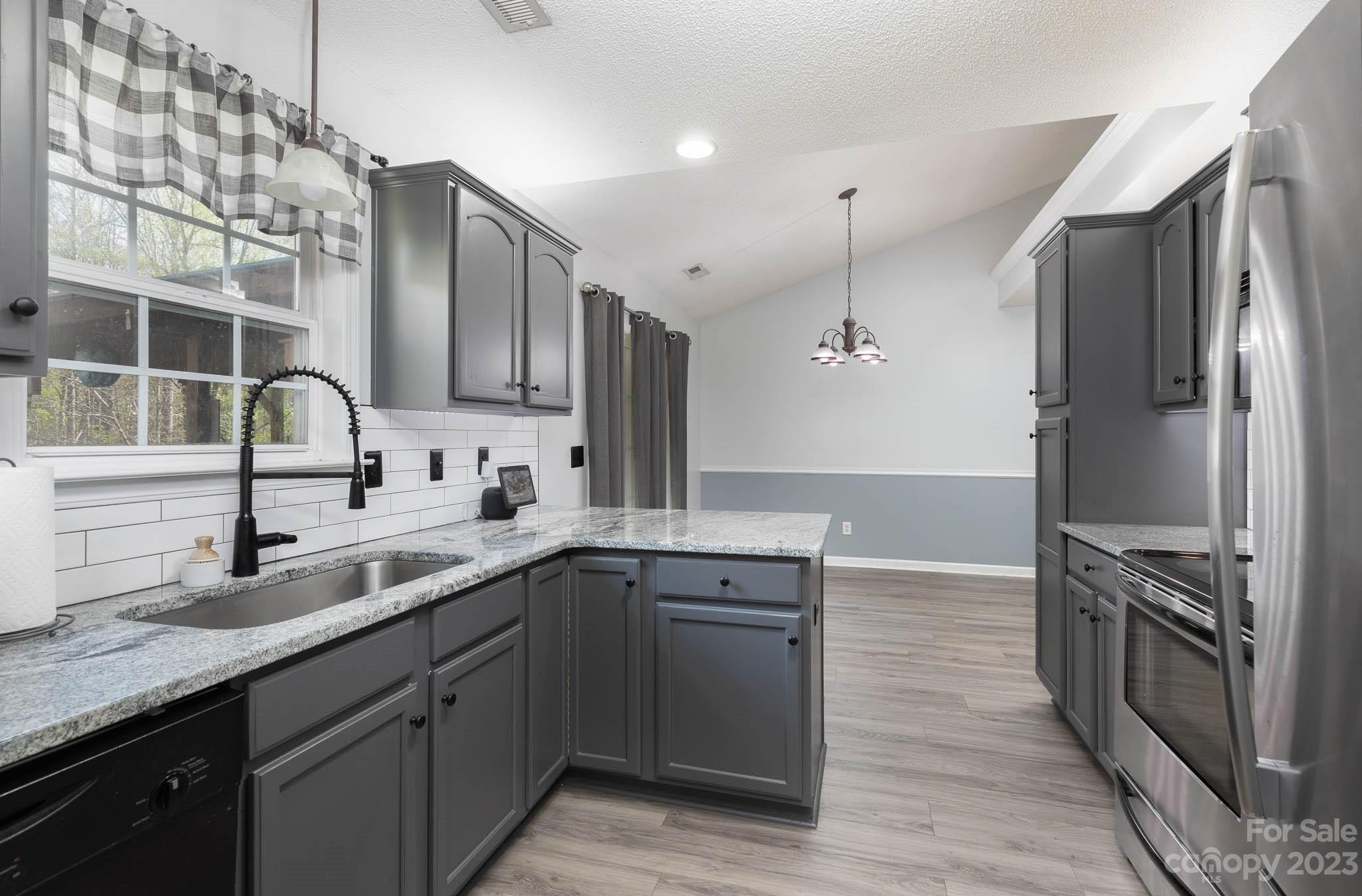 1503 George Dunn Road Rock Hill, SC 29730 - Photo 6 of 21 a kitchen with a sink refrigerator and cabinets