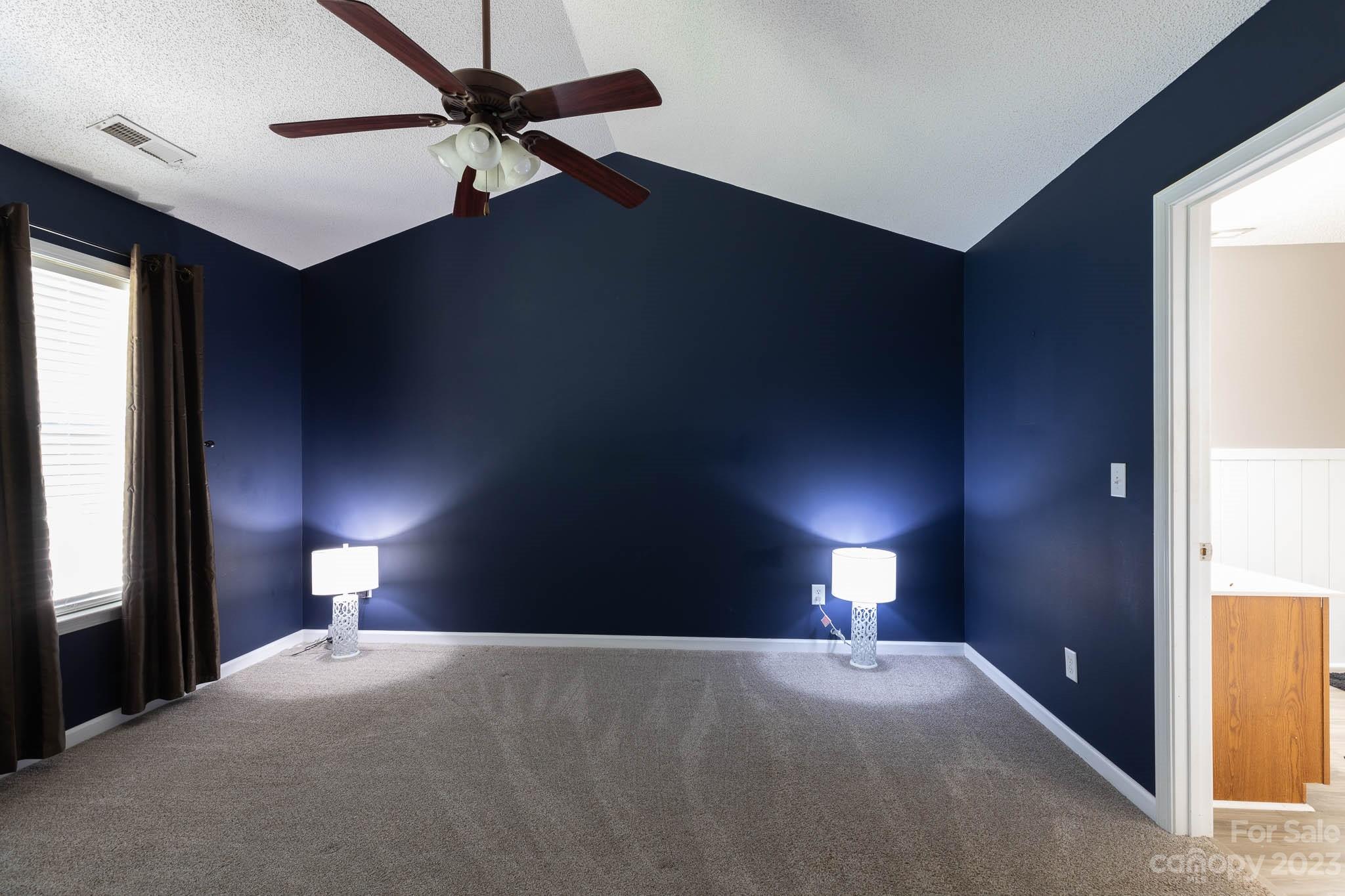 1503 George Dunn Road Rock Hill, SC 29730 - Photo 8 of 21 a bed room with a bed and a lamp