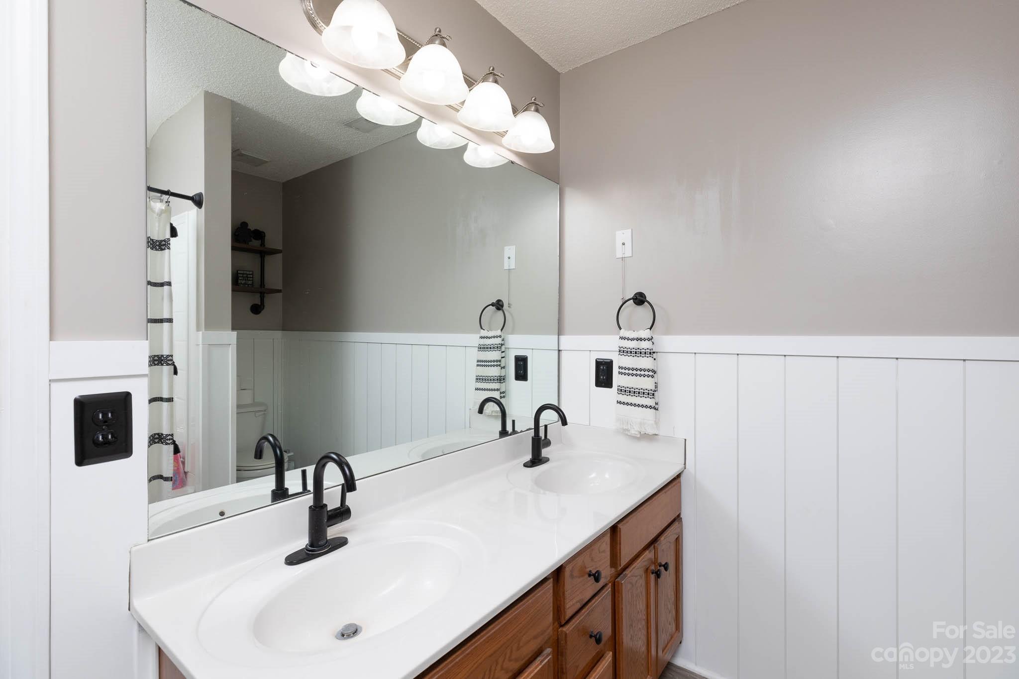 1503 George Dunn Road Rock Hill, SC 29730 - Photo 10 of 21 a bathroom with a sink vanity and a mirror