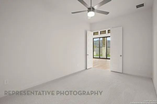 a view of a hall with stairs