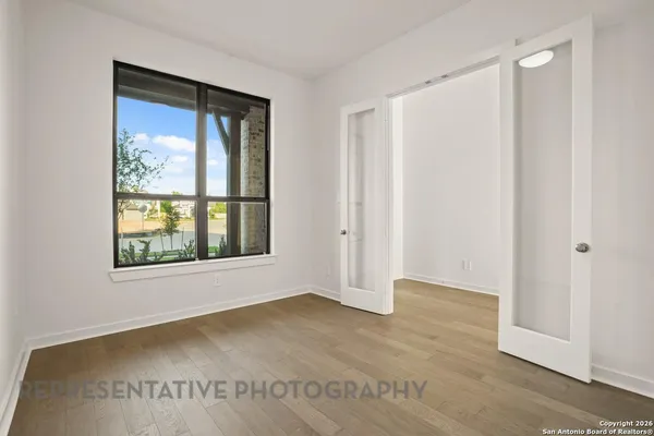 a view of an empty room with a window