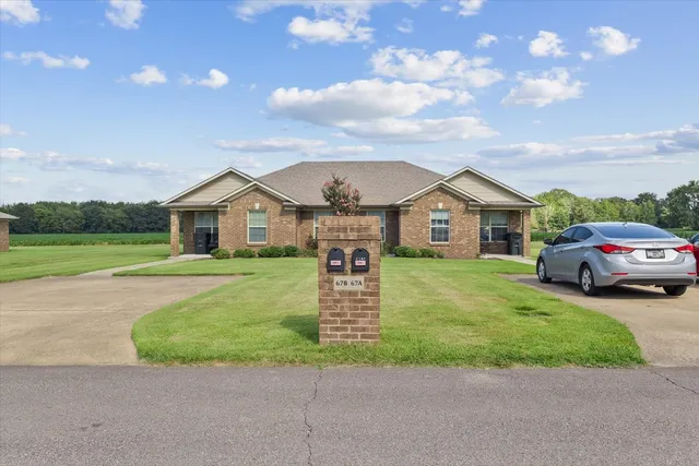 a kitchen with stainless steel appliances granite countertop a stove and cabinets