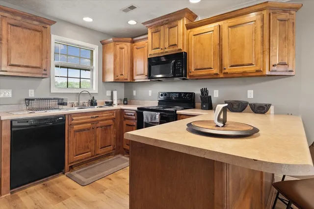 an empty room with window and fan