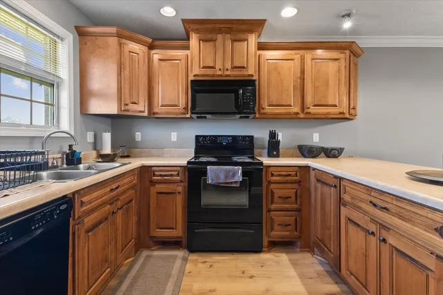 a view of a room with wooden floor