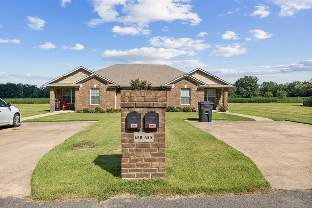 a bathroom with a sink mirror and toilet