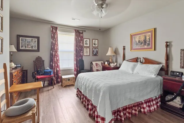 a kitchen with a dining table chairs stainless steel appliances and cabinets