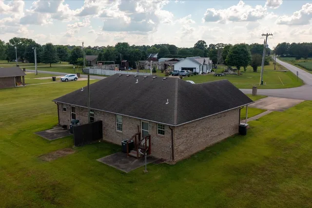 an aerial view of a house with a garden