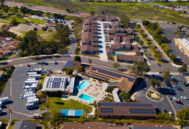 a living room with furniture a rug and a fireplace