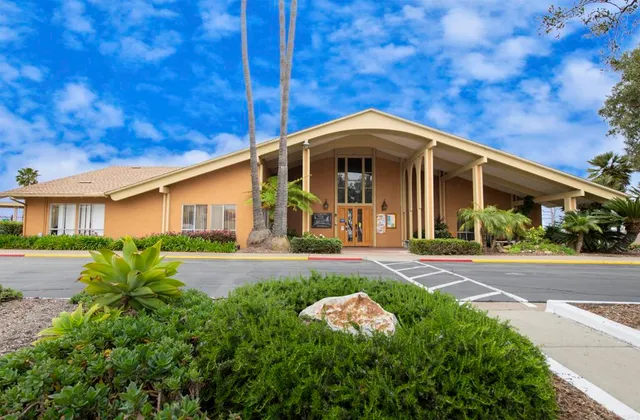 a view of a patio with a table and chairs