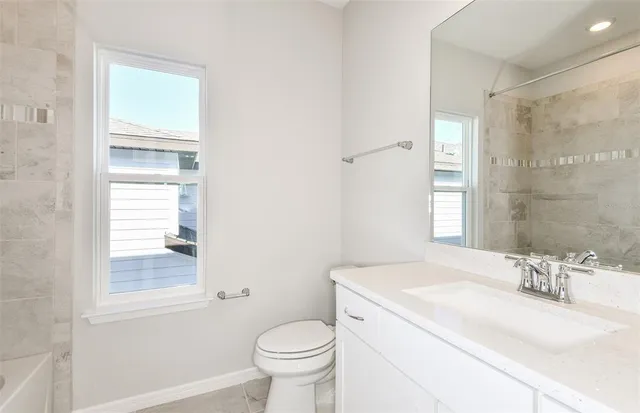 a bathroom with a sink toilet and vanity
