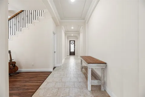 a view of an entryway with wooden floor