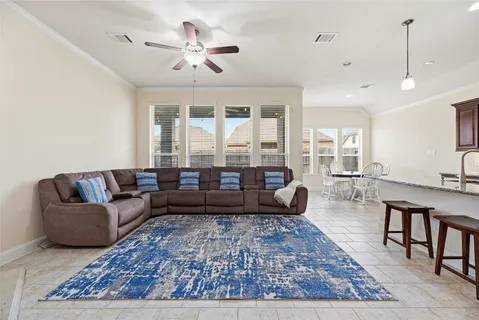 a living room with furniture and a rug