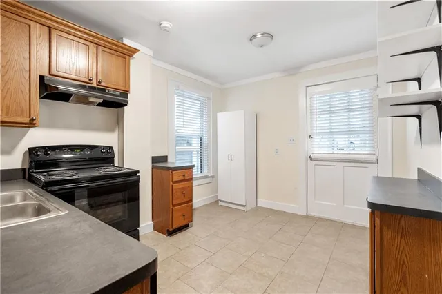 a kitchen with stainless steel appliances a stove and a refrigerator