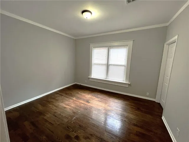a bathroom with a glass door shower and a sink