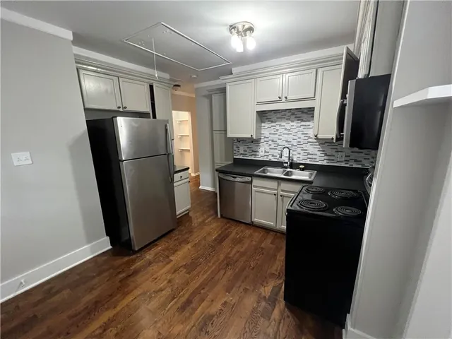 a view of a large building next to a yard