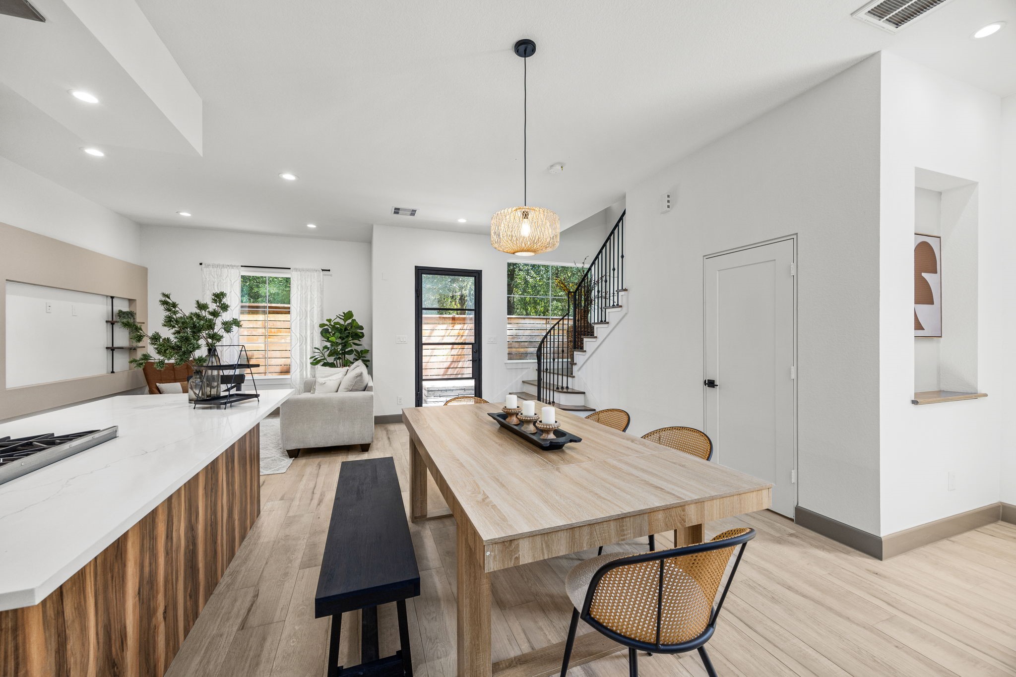 7934 Hennessy Lane, Unit 6 Spring, TX 77389 - Photo 17 of 36 a view of a dining room and livingroom with furniture wooden floor a chandelier