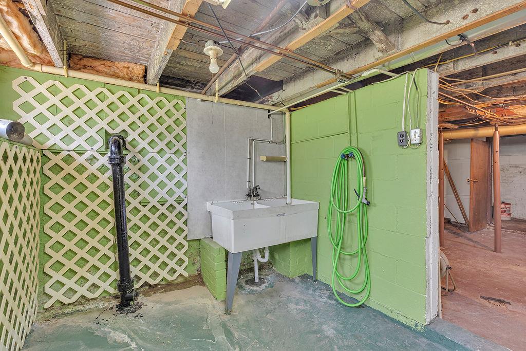 4706 Rochester Road New Brighton, PA 15066 - Photo 25 of 28 Laundry access with utility sink in basement as well.