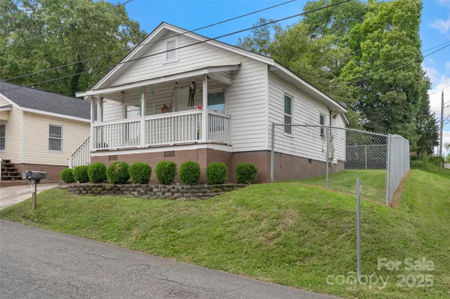 a view of a yard in front view of a house