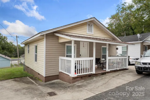 a front view of a house with parking space