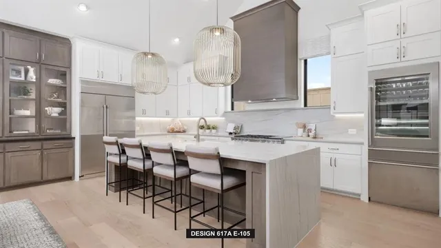 a kitchen with a sink stove and white cabinets