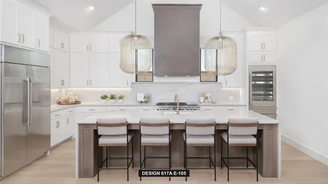 a kitchen with granite countertop a sink cabinets and refrigerator