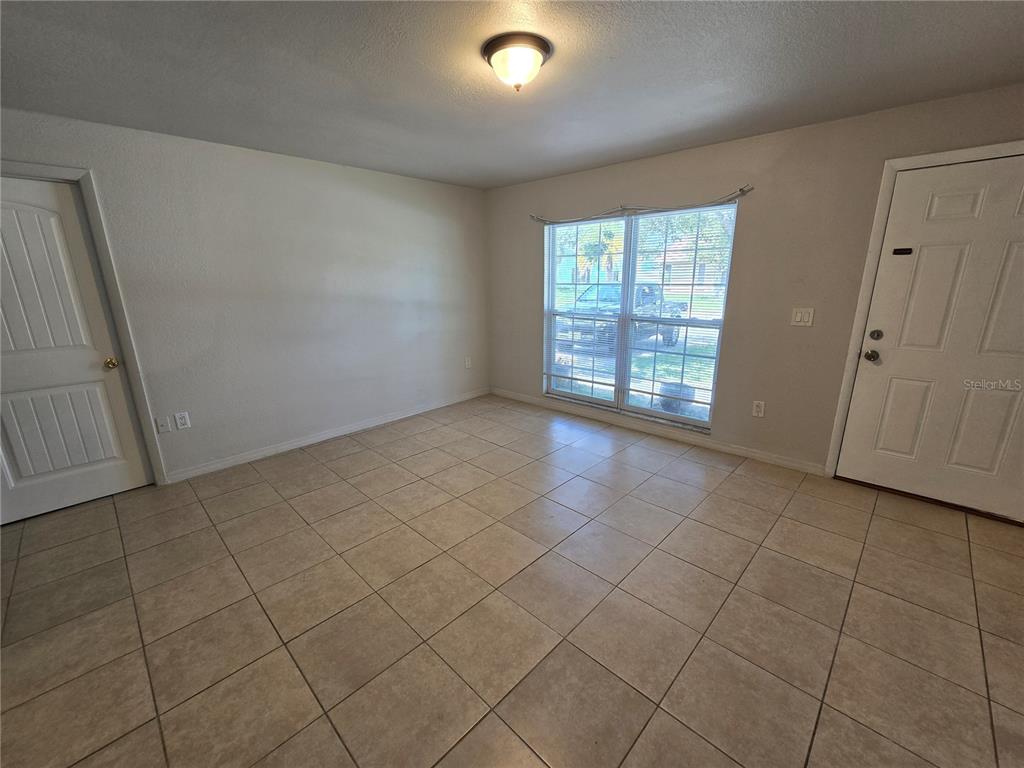 3406 Murrow Street New Port Richey, FL 34655 - Photo 3 of 21 a view of an empty room with a window