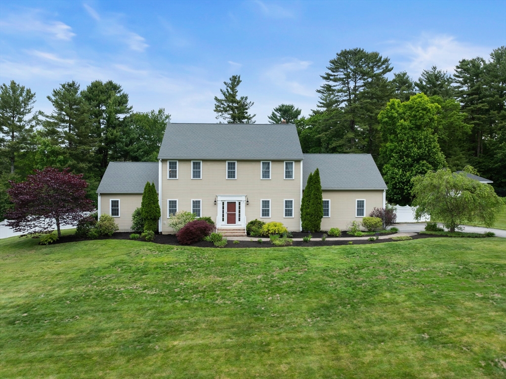55 Arbor Road Uxbridge, MA 01569 - Photo 12 of 12 a front view of a house with a garden