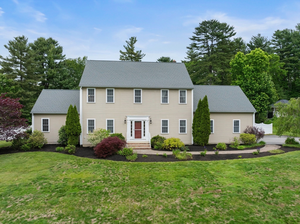 55 Arbor Road Uxbridge, MA 01569 - Photo 3 of 12 a front view of a house with a yard