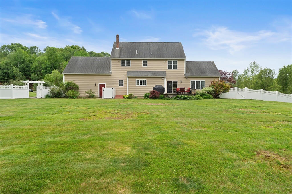 55 Arbor Road Uxbridge, MA 01569 - Photo 8 of 12 a front view of a house with a yard