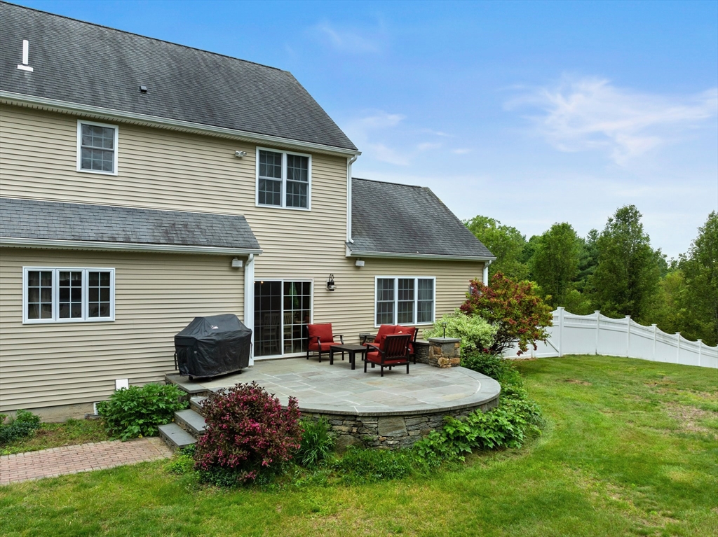 55 Arbor Road Uxbridge, MA 01569 - Photo 9 of 12 a front view of house with a garden
