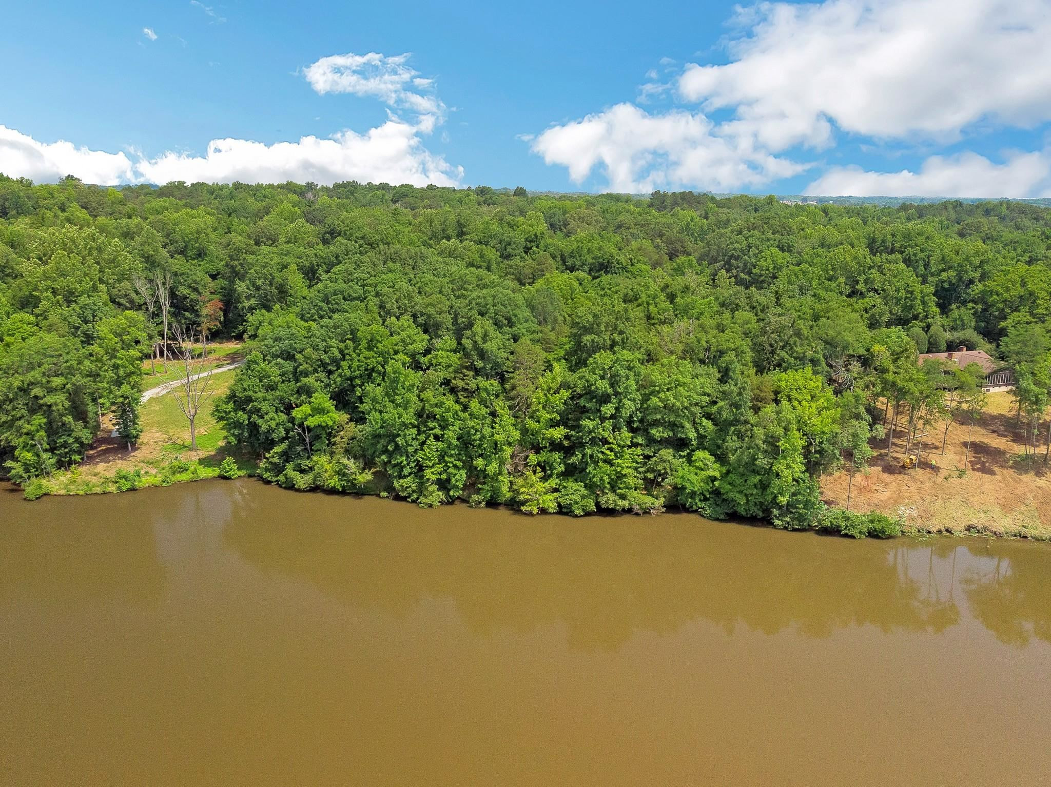 Lot D Canterberry Cv Road Leasburg, NC 27291 - Photo 3 of 3 a view of a lake with a mountain in the background