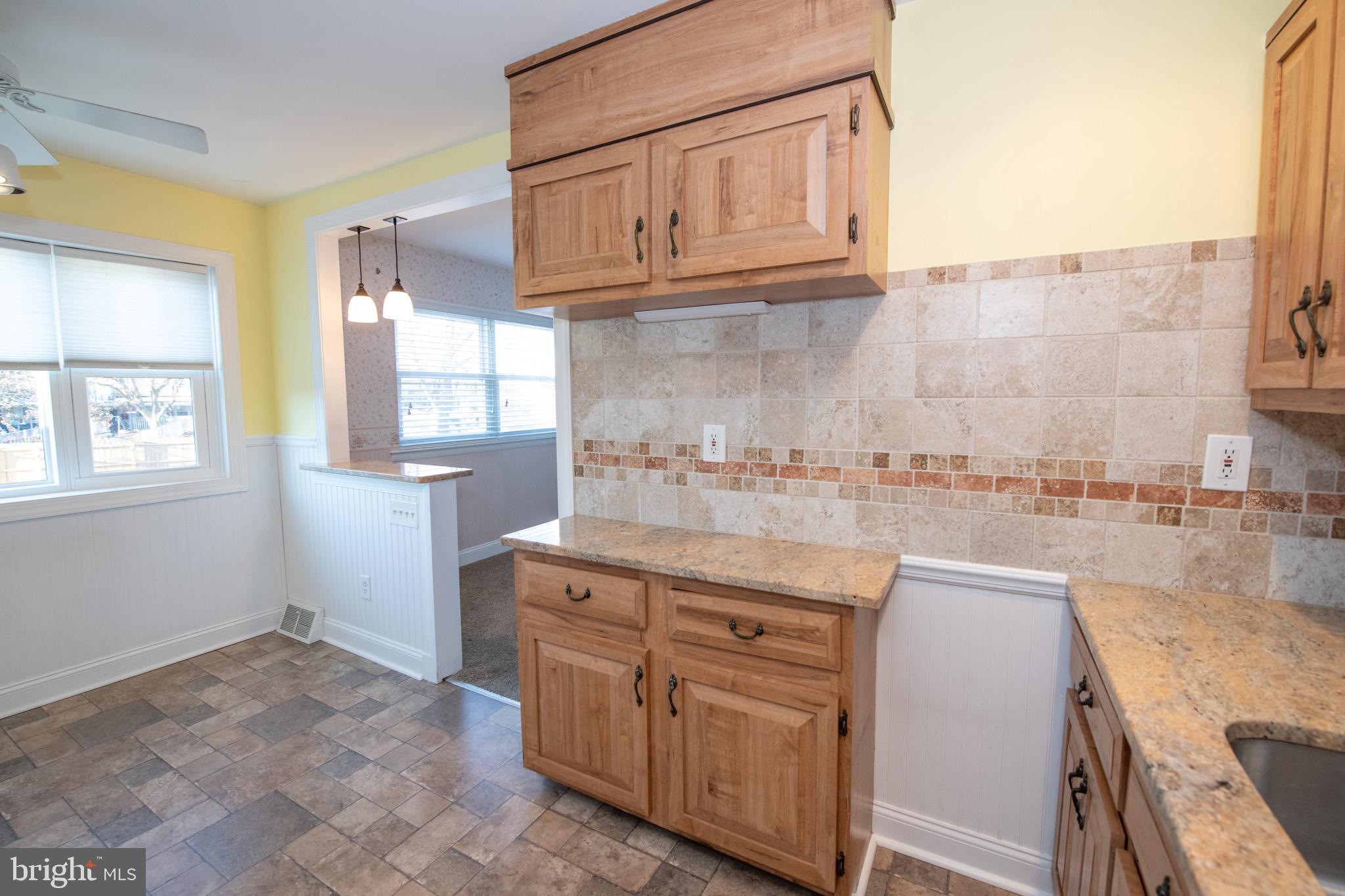 3210 Ancona Road Philadelphia, PA 19154 - Photo 20 of 46 a kitchen with stainless steel appliances granite countertop a stove a sink and a microwave