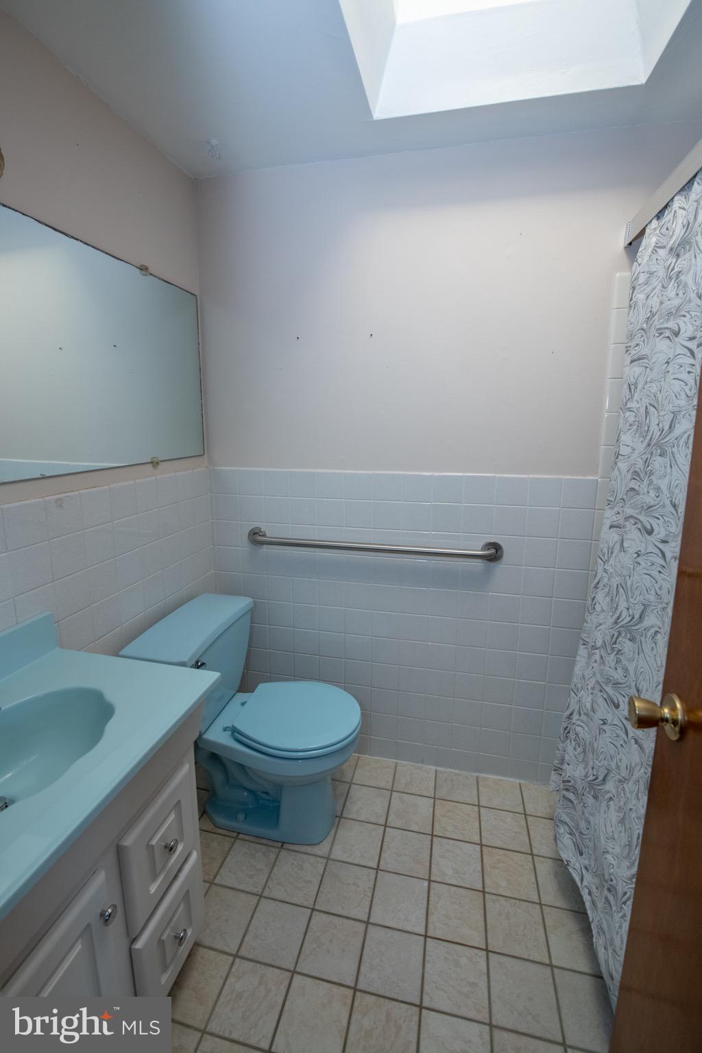 3210 Ancona Road Philadelphia, PA 19154 - Photo 27 of 46 a bathroom with a granite countertop toilet and a sink