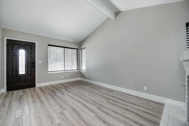 a kitchen with a sink stainless steel appliances and refrigerator