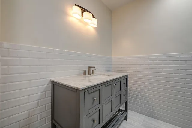 a view of backyard with wooden fence